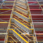 Safety in workplace. Renovation works. Scaffolding protects the workers from accidents. Laudo Técnico Andaimes